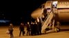 Czech diplomats expelled from Russia arrive at Vaclav Havel Airport in Prague on April 19.