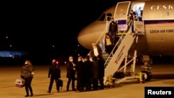 Czech diplomats expelled from Russia arrive at Vaclav Havel Airport in Prague on April 19.