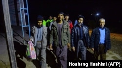 Afghan returnees arrive at an International Organization for Migration (IOM) transit center in Herat after returning from Iran in January 2018.