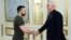 Ukrainian President Volodymyr Zelenskiy (left) meets with U.S. Congressman Adam Smith in Kyiv on July 23.