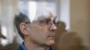 Paul Whelan stands inside a defendants' cage prior to a hearing of his lawyers' appeal against his arrest-term extension at the Moscow City Court in on September 17.