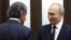 Russian President Vladimir Putin (right) greets International Atomic Energy Agency chief Rafael Grossi prior to their talks in Sochi on March 6. 