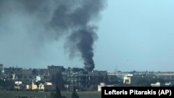 Smoke billows from a target in Tel Abyad during bombardment by Turkish forces on October 11.