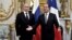 Russian President Vladimir Putin (left) met with French President Francois Hollande ahead of D-Day's 70th anniversary on June 6.