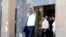 Armenia - Opposition figure Avetik Chalabian greets supporters as he emerges from a court building in Yerevan, August 21, 2026.