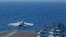 Un avian de luptă F/A-18E Super Hornet lansat de pe portavionul american USS Abraham Lincoln, 3 mai 2019