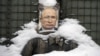 A bullet-riddled effigy of Russian President Vladimir Putin is coated by fresh snow at a frontline position in Ukraine's eastern Luhansk region in February 2022.