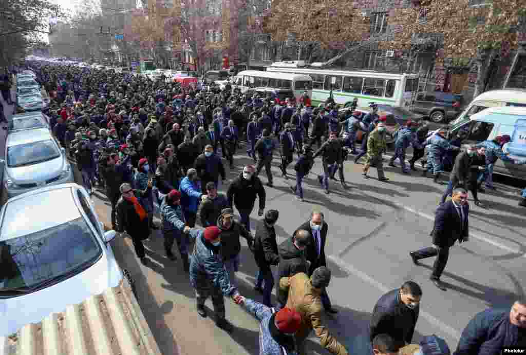 Pashinian (center left, holding a black loudspeaker) heads a protest march through Yerevan. He called on his supporters to meet in Yerevan&#39;s main Republic Square at 4 p.m. local time.&nbsp;