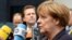 Cancelarul Angela Merkel adresîndu-se ziariștilor la Bruxelles înaintea summitului