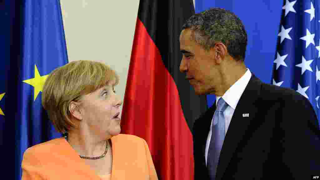 U.S. President Barack Obama and German Chancellor Angela Merkel share a moment after their joint press conference on June 19 at the Chancellery in Berlin. (AFP/Jewel Samad)