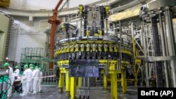 Personnel work to begin loading nuclear fuel at the nuclear plant near Astravets on August 7.