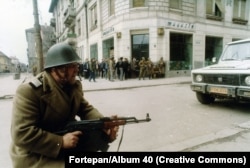 A Romanian soldier fighting alongside anti-government protestors in central Timisoara in December 1989.