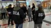 Mohamad Yassine and Hassan Abdul Rahman are handed over to U.S. DEA agents in Tbilisi airport on May 2.