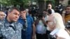 Armenia - Vladimir Gasparian (L), the chief of the Armenian police, argues with a protester in Yerevan, 26Jun2015.