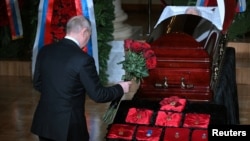 Russian President Vladimir Putin pays his respects to Vladimir Zhirinovsky during a memorial service in Moscow on April 8.