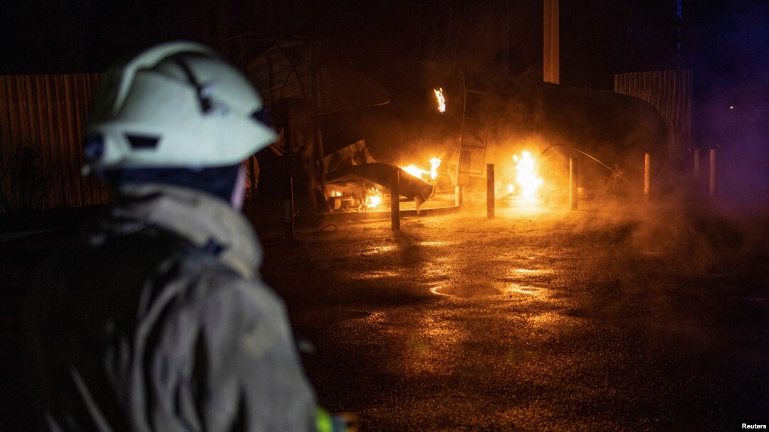 A rescuer looks on at the site of a Russian missile strike in the village of Kotlyary outside Kharkiv on April 22.