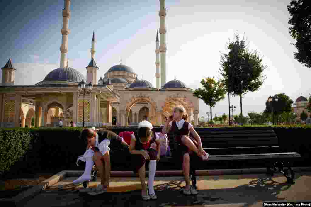 Girls gather after school in front of the Heart of Chechnya Mosque, the largest in Europe. All Chechen girls, regardless of their religion, must wear head coverings in public schools and government buildings.