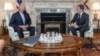 U.S. Secretary of State Antony Blinken (right) with U.S. special peace envoy for Afghanistan Zalmay Khalilzad (file photo)