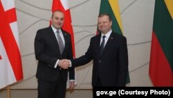 Мамука Бахтадзе (слева) и Саулюс Сквернялис 