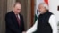 Russian President Vladimir Putin (left) shakes hands with Indian Prime Minister Narendra Modi during a photo opportunity ahead of their meeting at Hyderabad House in New Delhi on December 11.