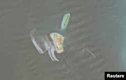 A satellite image shows a likely oil spill covering dozens of square kilometers near Iran's Kharg Island on May 6.