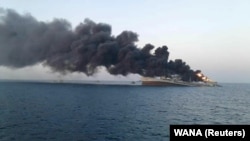 Smoke rises from the Kharg on June 2 in the Gulf of Oman near the port city of Jask.