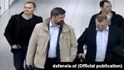 A photo released by the Dutch government purportedly showing four suspected Russian spies who traveled to the Netherlands on diplomatic passports earlier this year. 