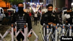 Police block the street after an explosion on a busy pedestrian street in Istanbul, Turkey, on November 13.