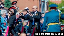 Russian President Vladimir Putin (center) attends the military parade on Red Square in Moscow for the Victory Day celebration in 2020.