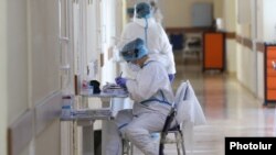 Armenia -- A medical worker takes notes at the Surp Grigor Lusarovich Medical Center in Yerevan, the country's largest hospital treating coronavirus patients, June 5, 2020.