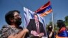 ARMENIA -- A supporter of Armenian opposition leader Gagik Tsarukian holds its portrait during a unauthorized rally close to National Secuirury Service headquarter in Yerevan, June 14, 2020