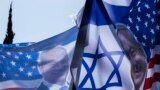 ISRAEL -- Flags of Benjamin Netanyahu with the Star of David and the American Stars and Stripes are visible on top of a truck parked outside a school where voting is taking place in the Israel general elections in Rosh HaAyin, outside of Tel Aviv, April 9