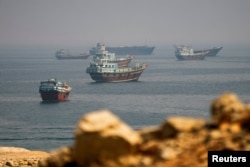 Vessels near the Strait of Hormuz, as seen from Musandam, Oman, on August 31.