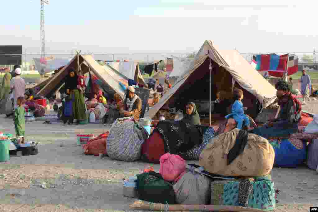 Afghan refugees rest in tents at a makeshift camp in Chaman on August 31.