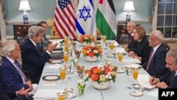 U.S. Secretary of State Kerry (center left) hosts the iftar meal at the State Department for Israeli and Palestinian negotiators.