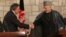 U.S. Defense Secretary Leon Panetta (left) shakes hands with Afghanistan President Hamid Karzai in Kabul on December 13.