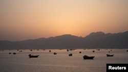 Ships and boats in the Strait of Hormuz near Musandam, Oman
