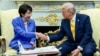 US President Donald Trump shakes hands with Japanese Prime Minister Sanae Takaichi in the Oval Office at the White House in Washington on March 19.