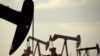 In this April 24, 2015 file photo, pumpjacks work in a field near Lovington, N.M. File photo