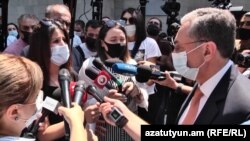 Armenian Foreign Minister Zohrab Mnatsakanian talking to protesters outside the government offices in Yerevan, August 12, 2020.