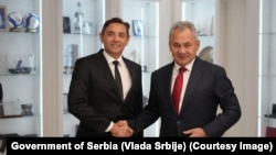 Serbian Deputy Prime Minister Aleksandar Vulin (left) meets with the secretary of Russia's Security Council, Sergei Shoigu, in Moscow on September 8. 