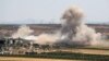 Smoke billows during reported Syrian government shelling of the village of Sheikh Mustafa in the rebel-held Idlib Province.