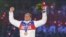 Russian gold-medalist Aleksandr Legkov celebrates on the podium during the men's cross-country skiing 50-kilometer mass-start free victory ceremony at the Sochi Winter Olympics in February 2014.