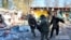 A body is removed after Russian shelling of Kupyansk on October 24.