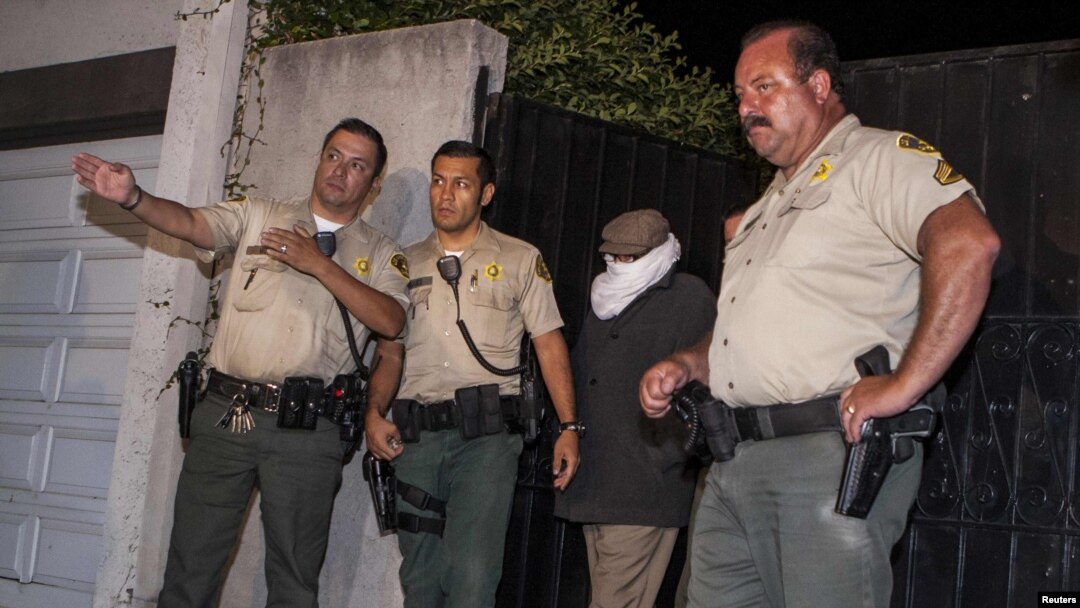 Mark Basseley Youssef (second from right), the man thought to be behind the controversial smear video "Innocence Of Muslims," is led from his southern California home by sheriffs in September.