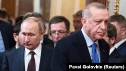 RUSSIA -- Russian President Vladimir Putin and Turkish President Tayyip Erdogan arrive for a news conference following their talks in Moscow, March 5, 2020