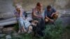 Local residents tearfully refuse to be evacuated from the town of Toretsk, near a front line in Ukraine's Donetsk region, on July 3.