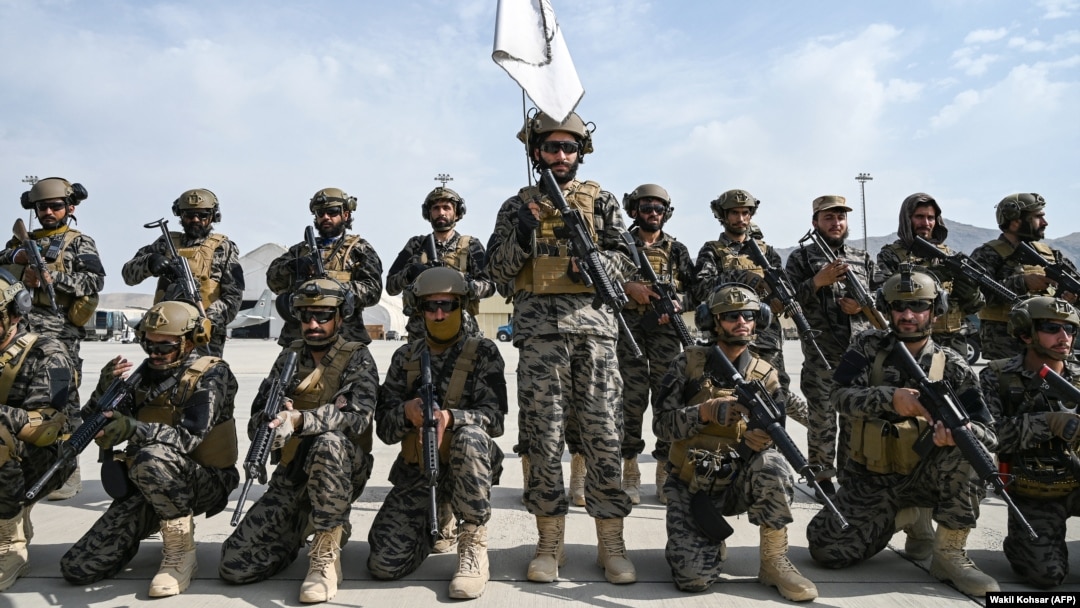 Members of the Taliban's Badri special forces take positions at the airport in Kabul on August 31.