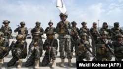 Members of the Taliban's Badri special forces take positions at the airport in Kabul on August 31.