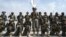 Members of the Taliban's Badri special forces take positions at the airport in Kabul on August 31.